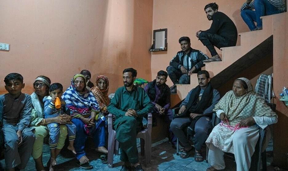  In this picture taken on March 2, 2023, mourners gather at Muhammad Nadeem&rsquo;s house in Gujrat district of Punjab province, who died in Libya boat capsizing along with other migrants. &mdash; AFP 