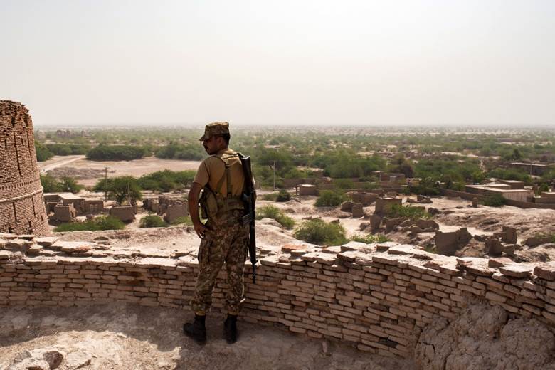 A soldier on the ramparts of Derawar Fort looking out over the Cholistan desert.