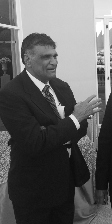 A person in a suit and tie AI-generated content may be incorrect.