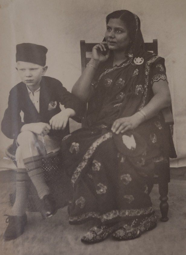 A person sitting next to a child AI-generated content may be incorrect.