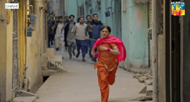 A person running in an alley AI-generated content may be incorrect.