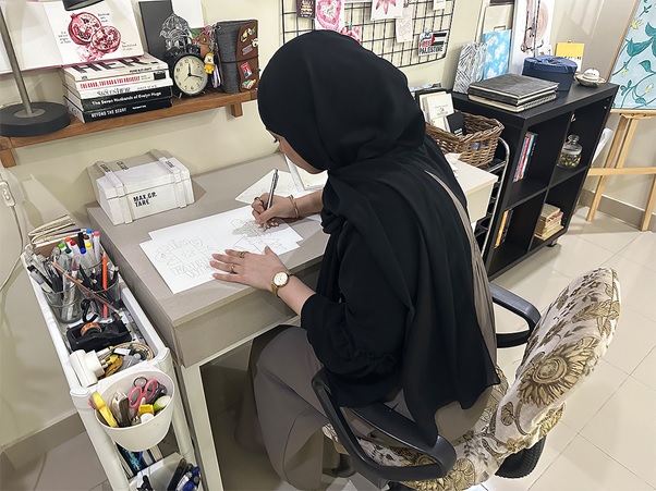 A person sitting at a desk writing on paper AI-generated content may be incorrect.