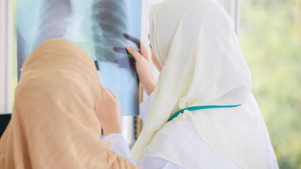 A person looking at an x-ray AI-generated content may be incorrect.