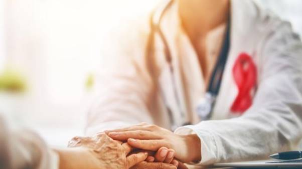 A doctor holding a patient's hand AI-generated content may be incorrect.