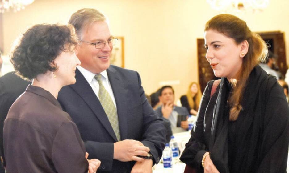 US Ambassador Donald Blome, Parliamentary Secretary for Climate Change Naz Baloch and acting Principal Deputy Assistant Secretary for South and Central Asian Affairs Elizabeth Horst engrossed in conversation at an event in Islamabad on Tuesday. &mdash; Photo by Tanveer Shahzad