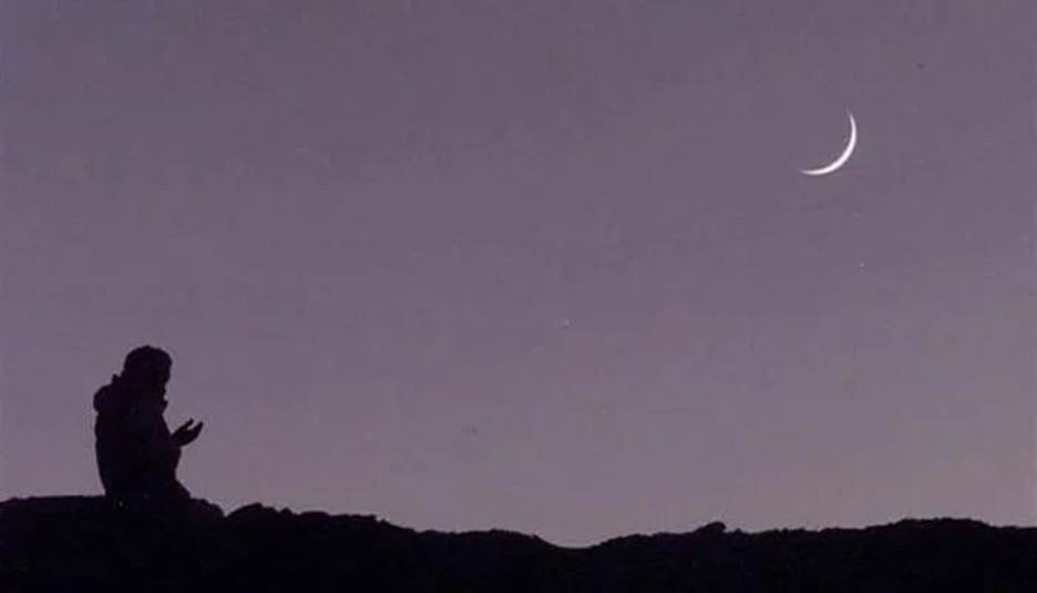 An undated image of a person praying after sighting the moon. &mdash; AFP/File