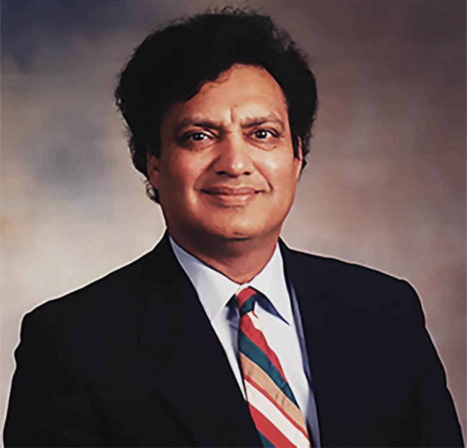 A person in a suit and tie Description automatically generated