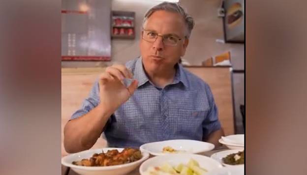 This screengrab of a video released on June 8, 2024 shows US Ambassador to Pakistan, Donald Blome, enjoying food at Karachi&rsquo;s Burns Road food street. &mdash; US Consulate General Karachi