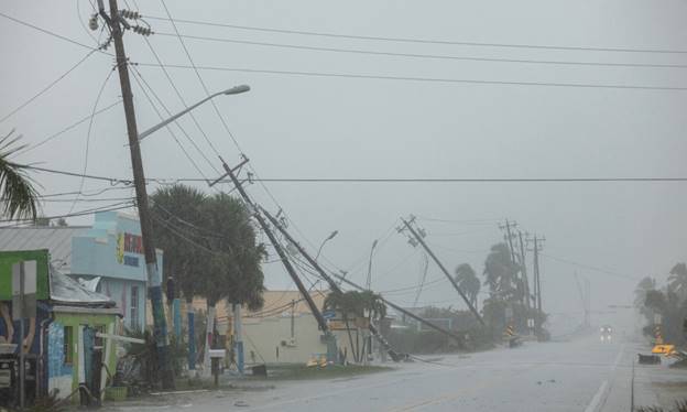 Broken utility poles downed by strong wind gusts are seen as Hurricane Milton approaches Fort Myers, Florida, US on Oct 9, 2024. &mdash; Reuters