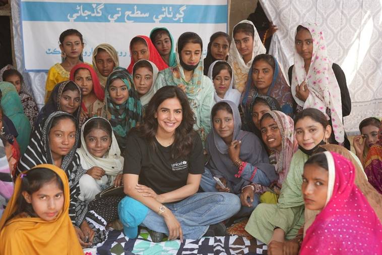 Actor Saba Qamar poses for a photo with a group of girls. &mdash;Unicef