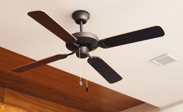 A ceiling fan with a wooden ceiling AI-generated content may be incorrect.