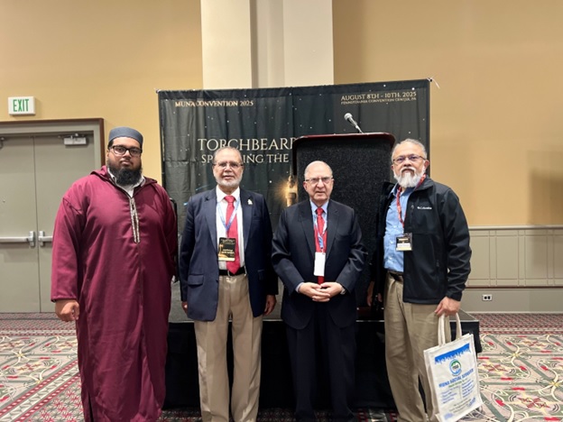 A group of men standing in front of a stage AI-generated content may be incorrect.