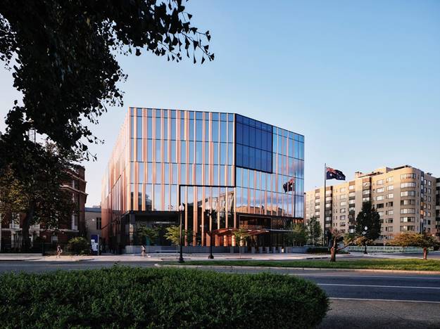 A building with glass walls and a glass wall AI-generated content may be incorrect.