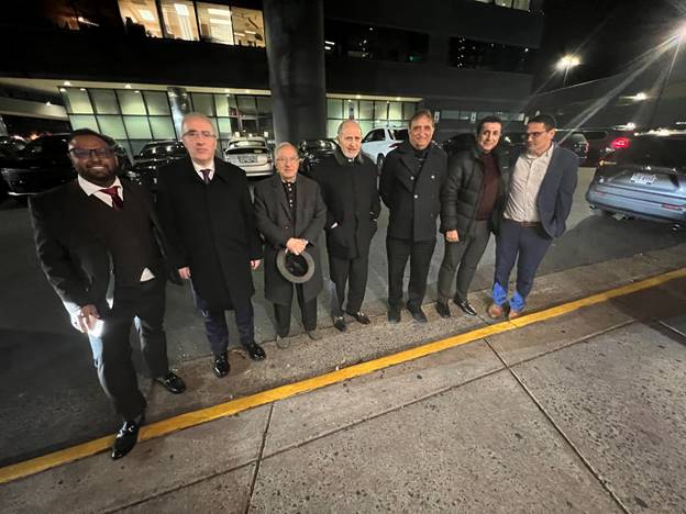 A group of men standing on the side of a road AI-generated content may be incorrect.