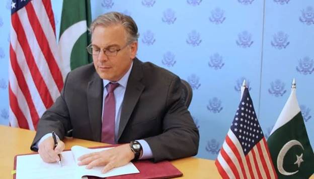 US Ambassador Donald Blome signs the second US-Pakistan bilateral agreement on September 30, 2022. &mdash; APP