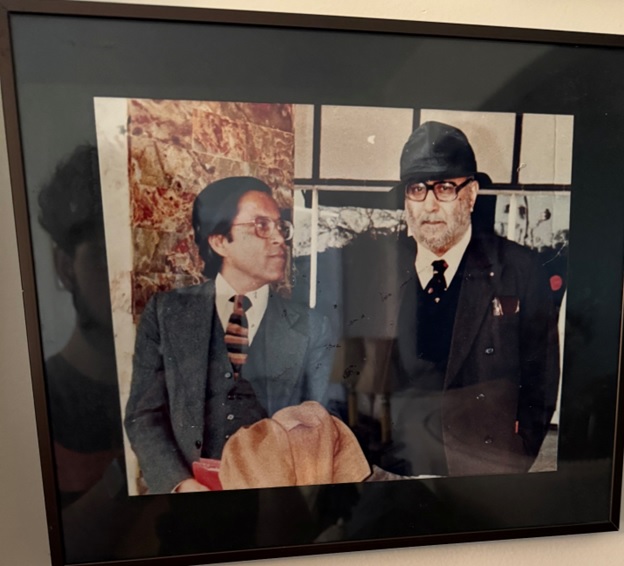 A framed picture of men in suits AI-generated content may be incorrect.