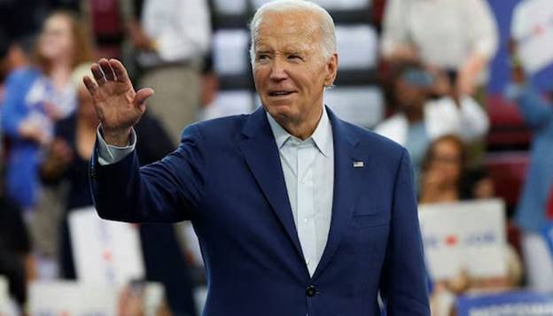 US President Joe Biden waves to his supporters during a campaign stop in Detroit, Michigan, U on July 12, 2024. &mdash; Reuters