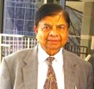 A person in a suit and tie AI-generated content may be incorrect.