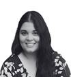 A person with long hair smiling  AI-generated content may be incorrect.