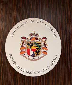 A white plate with a coat of arms and a crown on it AI-generated content may be incorrect.