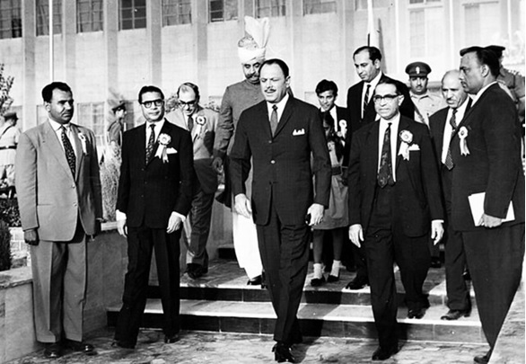 A group of men walking down stairs AI-generated content may be incorrect.