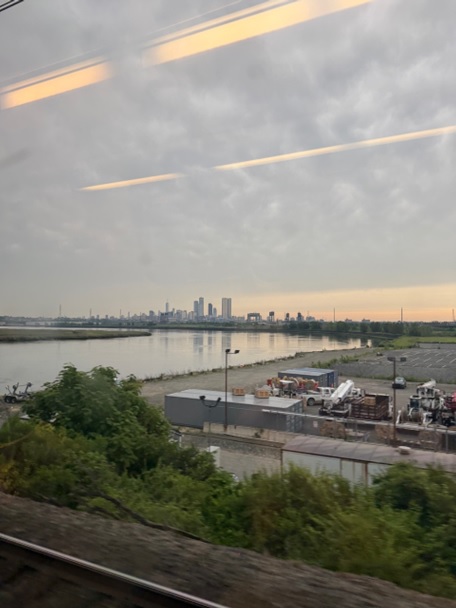 A city skyline seen from a window AI-generated content may be incorrect.