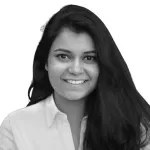 A person with long hair smiling AI-generated content may be incorrect.
