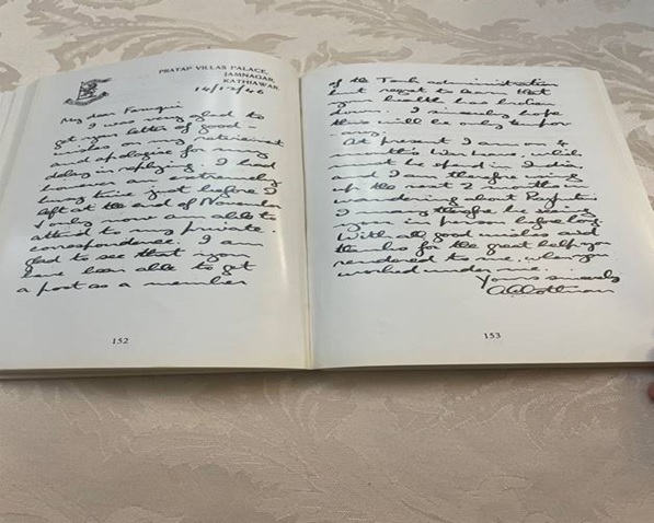 A hand holding a book AI-generated content may be incorrect.