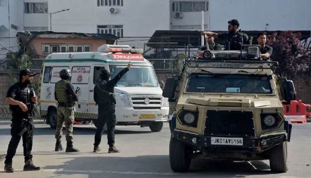 Indian security forces personnel escort an ambulance carrying the bodies of tourists who were killed in a suspected militant attack near Pahalgam, outside the police control room in Srinagar. &mdash; Reuters