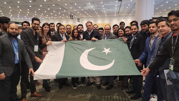 A group of people holding a flag AI-generated content may be incorrect.