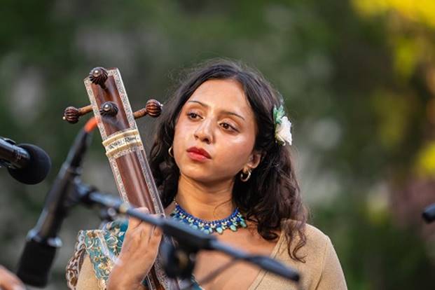A person playing a musical instrument AI-generated content may be incorrect.